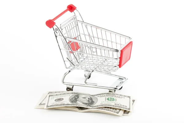 Stock image Shopping cart and dollars