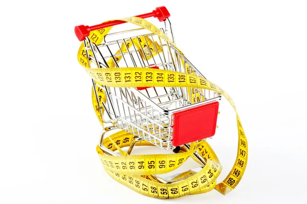 Shopping cart and tape measure — Stock Photo, Image