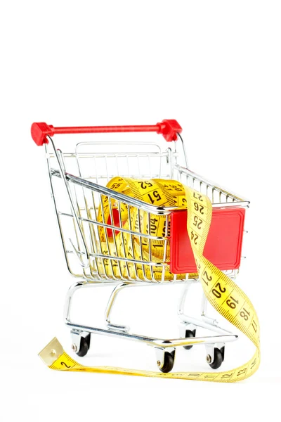 Shopping cart and tape measure — Stock Photo, Image