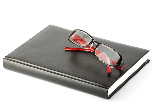 Book with eyeglass — Stock Photo, Image