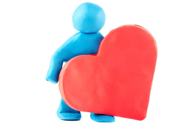Plasticine man with plasticine heart — Stock Photo, Image