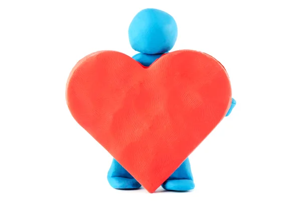 Plasticine man with plasticine heart — Stock Photo, Image