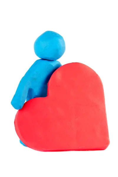 Человек-пластилин с пластилиновым сердцем — стоковое фото