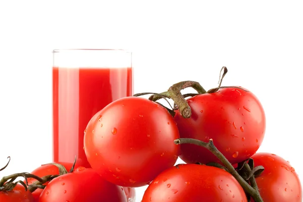 Pilha de tomate perfeito com suco — Fotografia de Stock