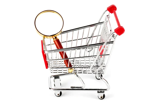 Magnifying glass & shopping trolley — Stock Photo, Image