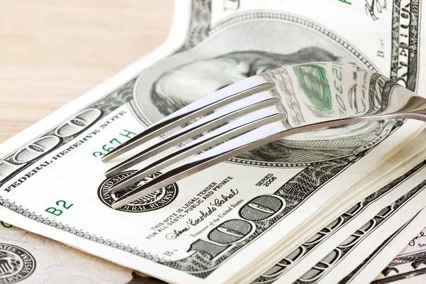 Fork and dollars Stock Picture
