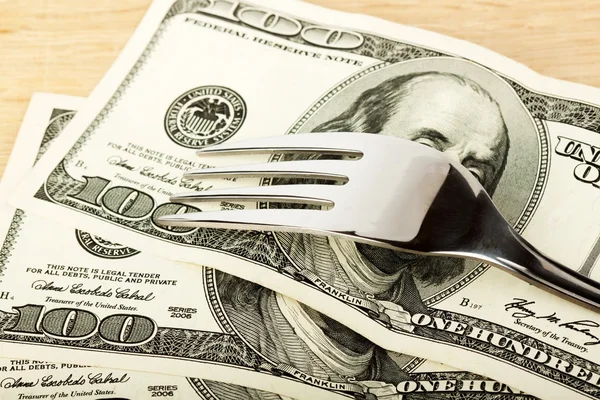 Fork and dollars Royalty Free Stock Images