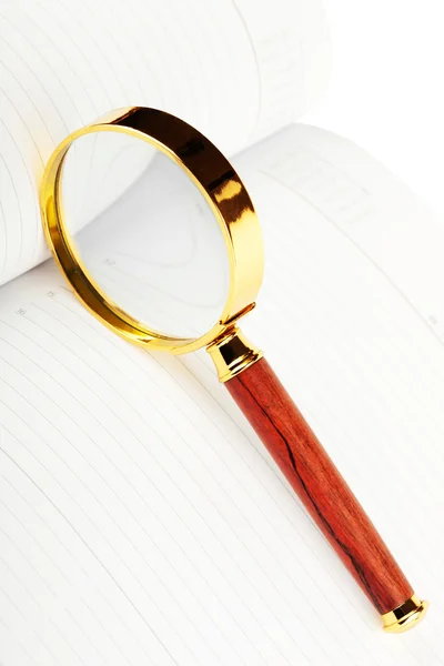 Magnifying glass over the diary — Stock Photo, Image
