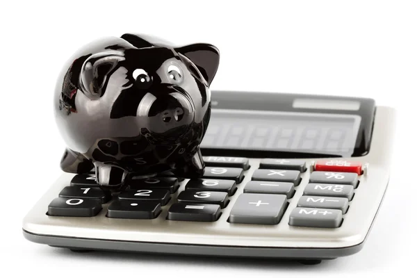 Calculadora e banco porquinho — Fotografia de Stock