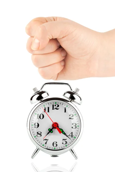 Alarm clock and a fist — Stock Photo, Image