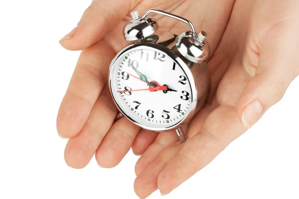 Relógio despertador com as mãos — Fotografia de Stock