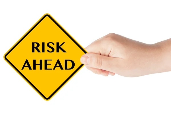 Risk Ahead sign with hand — Stock Photo, Image