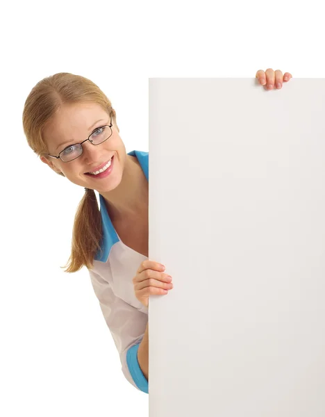Beautiful young nurse holding a blank banner isolated — Stock Photo, Image