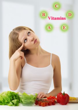 Beautiful young woman with vegetables choose foods rich in v clipart