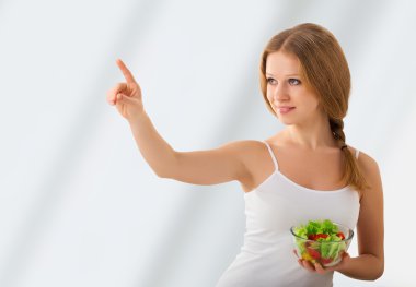 Beautiful girl with a salad choose healthy food clipart