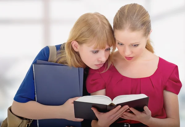 Two cute girls college reading book — Stock Photo, Image