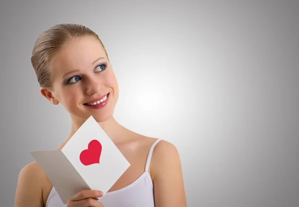 Beautiful girl with a love postcard valentines — Stock Photo, Image