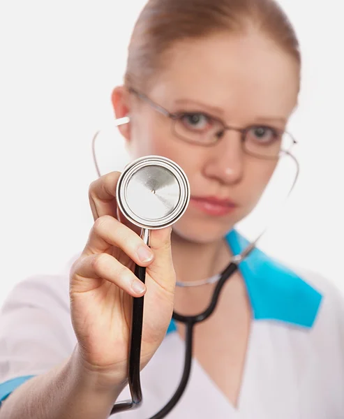Stethoscope and a woman doctor Royalty Free Stock Images
