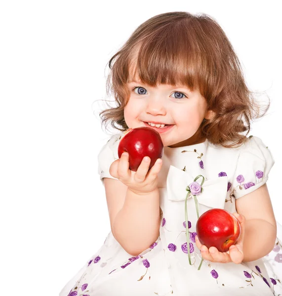 Portrait of a little girl eating apples — Stock Photo, Image
