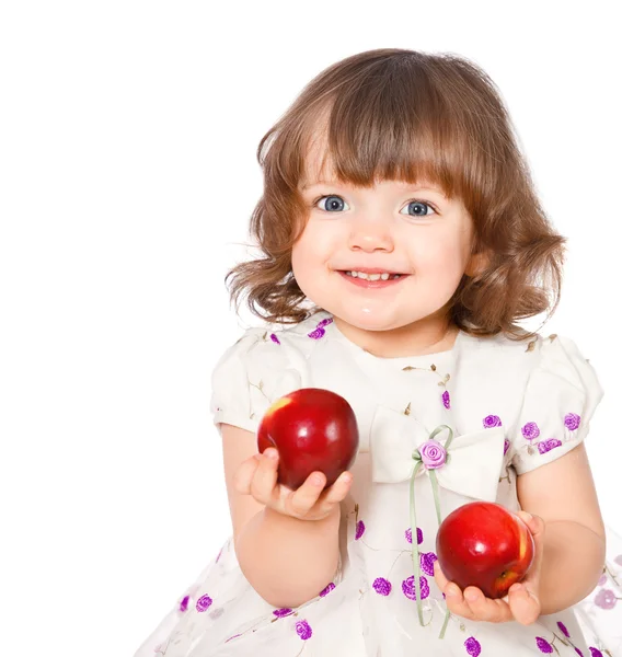 Retrato de uma menina comendo maçãs — Fotografia de Stock