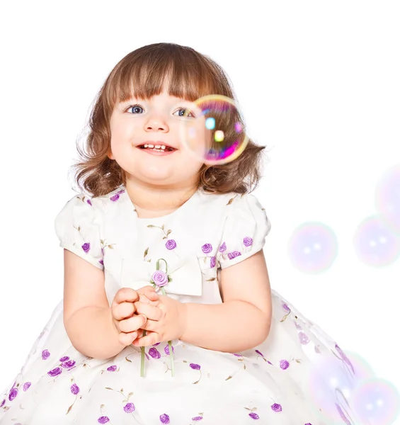 Little girl catches the bubbles — Stock Photo, Image