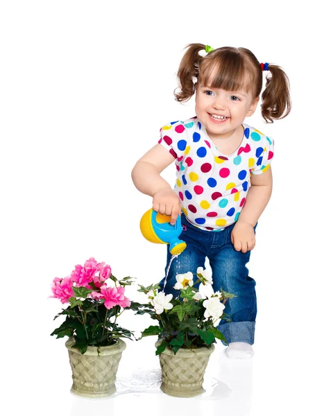 Bambina irrigazione fiori — Foto Stock