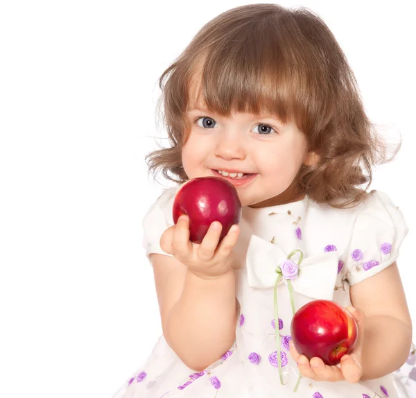 Ritratto di una bambina che mangia mele — Foto Stock