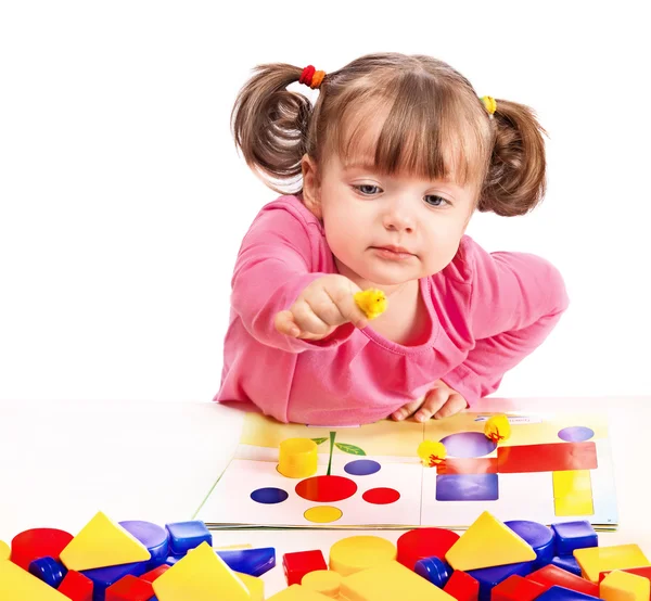 Child plays in developing games — Stock Photo, Image