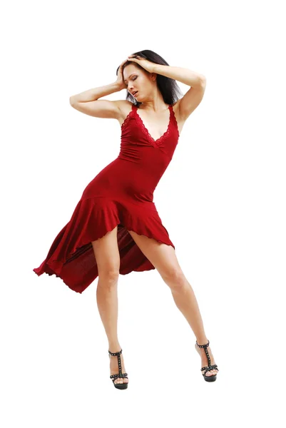 Девушка танцует в коктейльном платье — стоковое фото