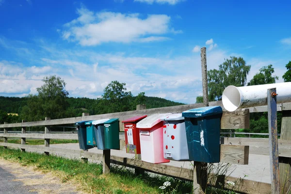 Country mailboxes on the fence — Stock Photo, Image