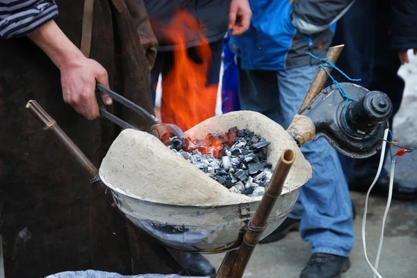 stock image Preparation of wrought knife in handheld forge