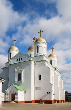 Austere orthodox cathedral against the blue sky clipart