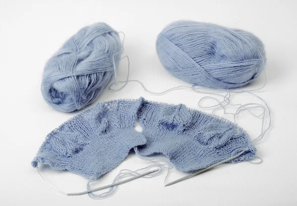 Knitted cloth with needles and clues — Stock Photo, Image