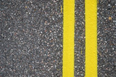 Close-up of road surfacing with lane lines clipart