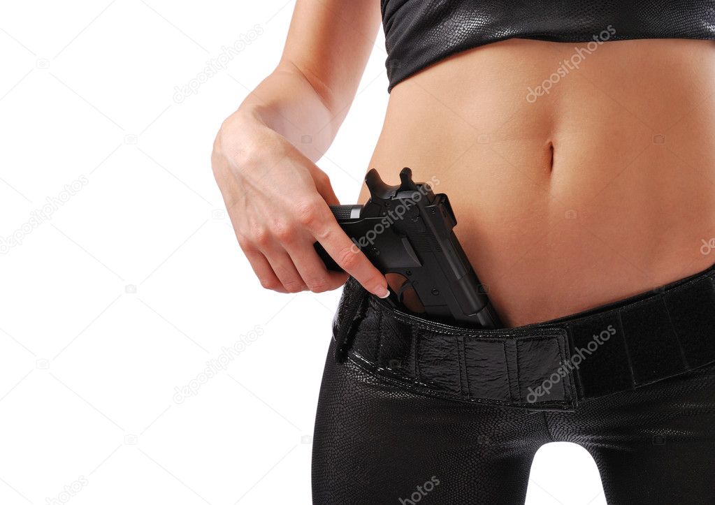 Female hand with pistol and sexy body in black leather.