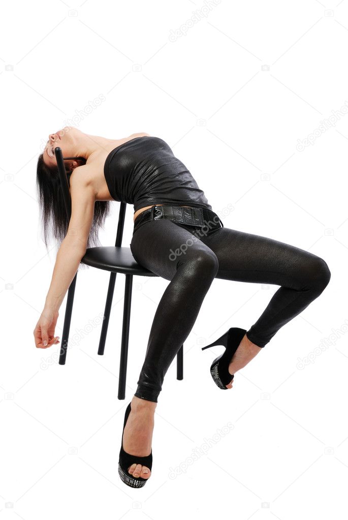 Sexy woman lying on the chair.