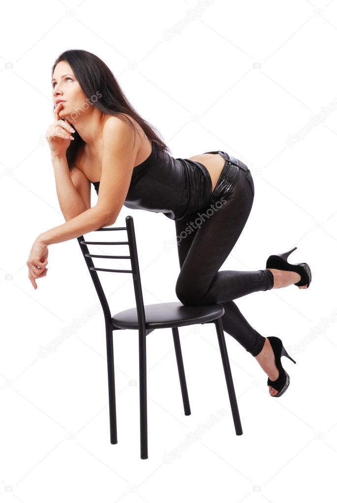Sexy woman thinking on the chair