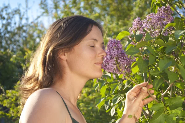 Smelling a lilac — Stock Photo, Image