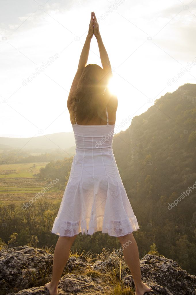 Raising arms to greet the sun