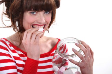 Woman eating marshmallows clipart