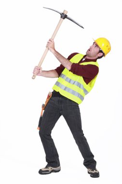 Worker with a pickaxe clipart