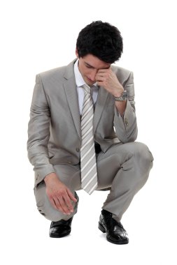 A sad businessman. clipart