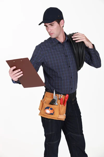 Electrician with a clipboard — Stock Photo, Image