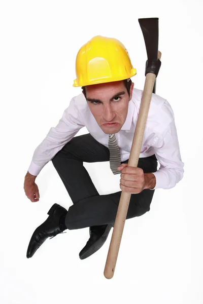 Disgruntled employee with a pickaxe — Stock Photo, Image