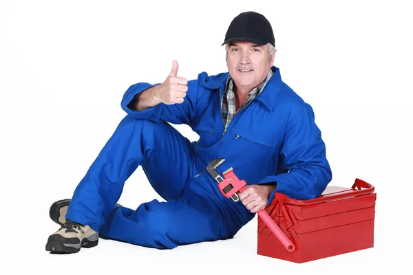 Approving tradesman posing with his tools — Stock Photo, Image