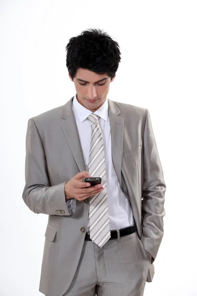 Empresario leyendo sms — Foto de Stock