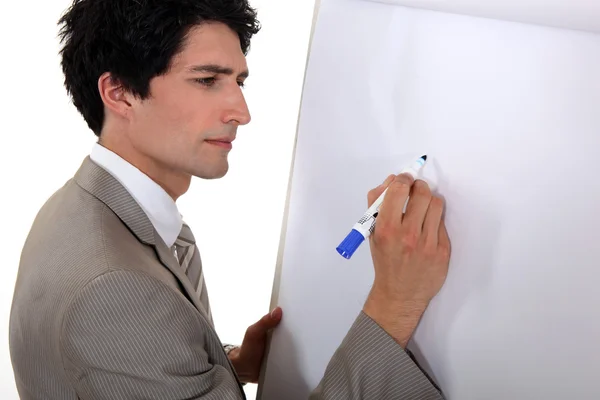 Mężczyzna rysunek na tablicę typu flip chart — Zdjęcie stockowe