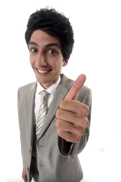 Grinning businessman giving the thumb — Stock Photo, Image