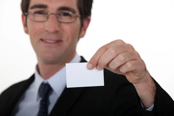 Executive with a blank business card — Stock Photo, Image