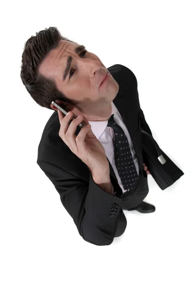 Бізнесмен приймає поганий телефонний дзвінок — стокове фото